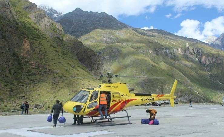 Himalayan Heli Services helicopter on a Char Dham helipad in the mountains